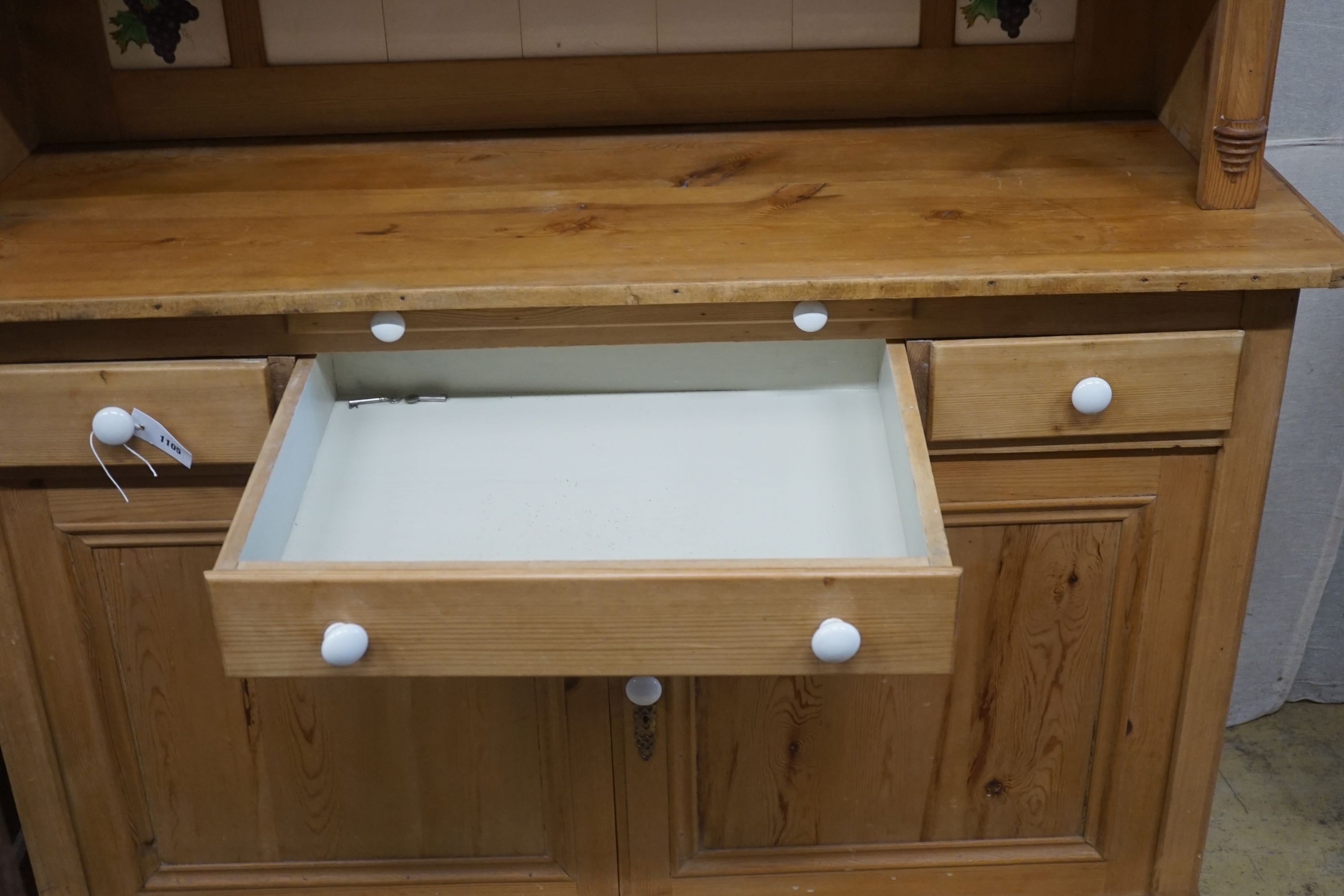 A 19th century Continental pine glazed side cabinet, width 142cm, depth 55cm, height 180cm